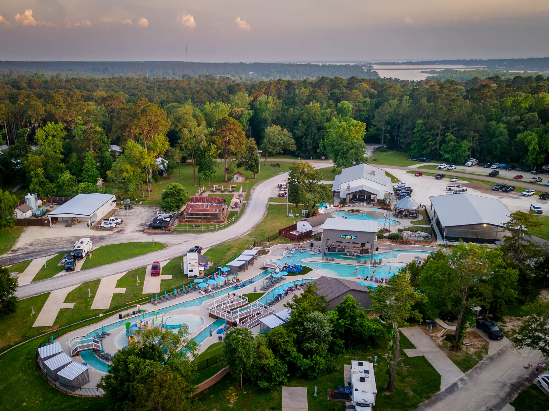 Aerial view of Two Creeks Crossing Resort, Blue Bayou Bend, and the surrounding trees